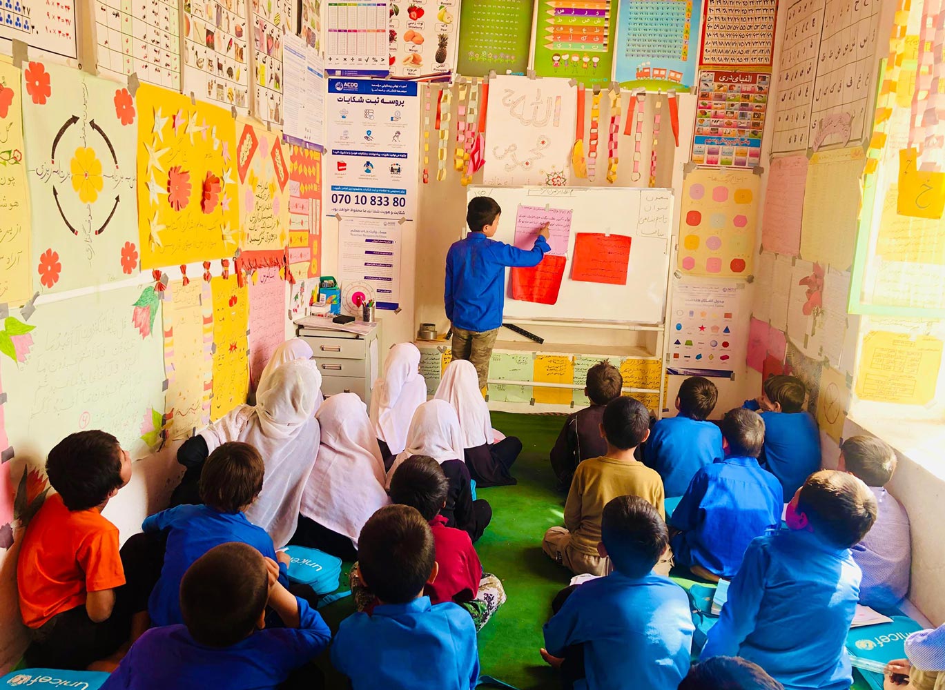 Jamal describing lesson to his classmates