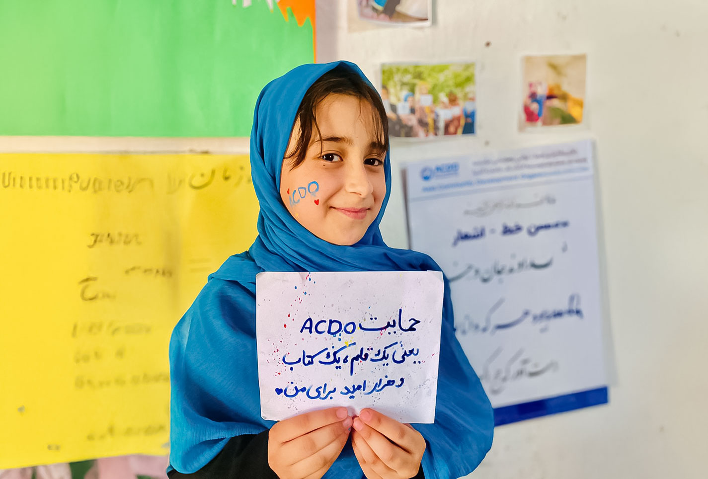Nazanin showing his message to ACDO and the Donor as gratitude 